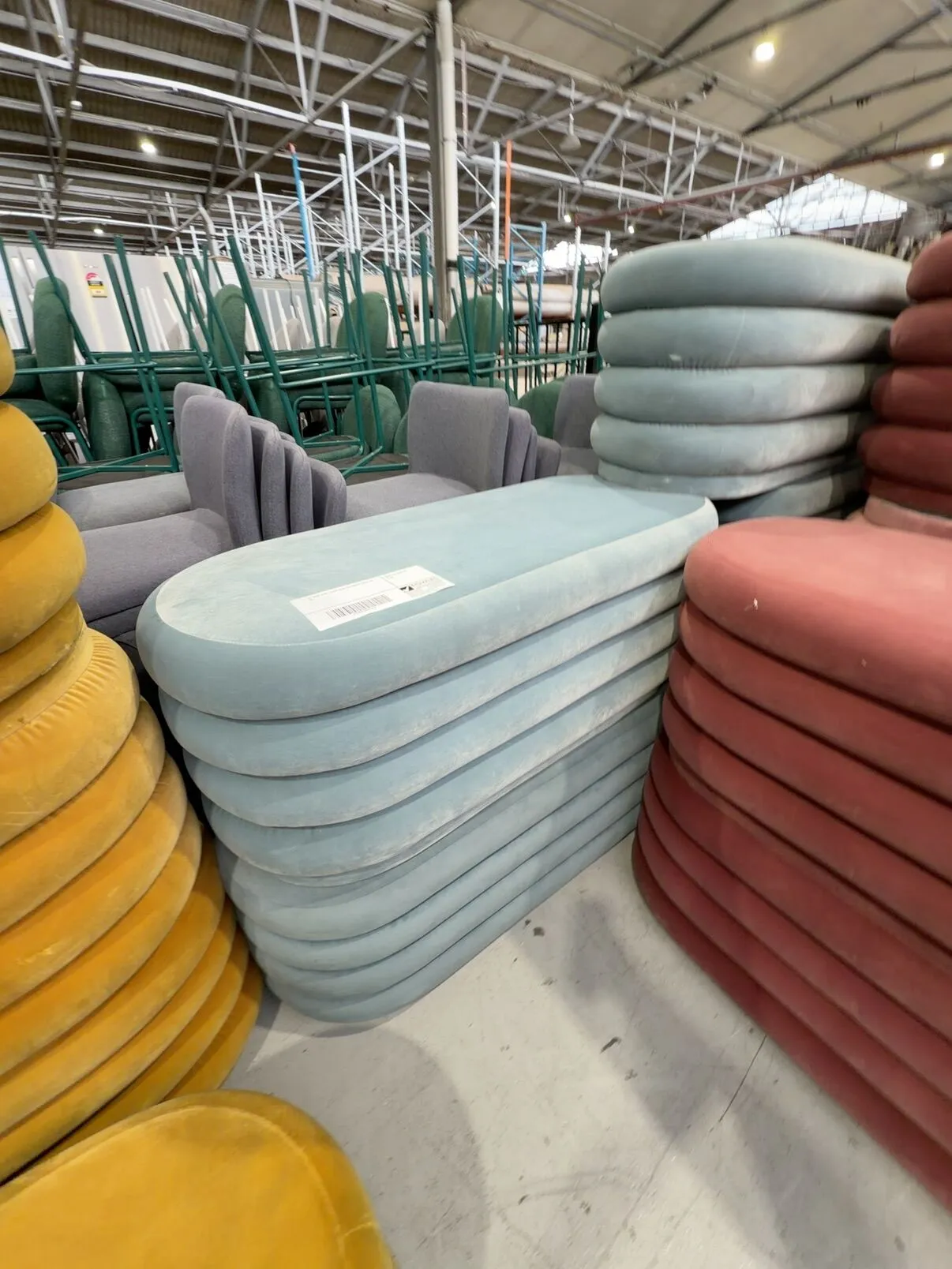 EX HIRE OVAL LIGHT BLUE OTTOMAN, SOLD AS IS EX HIRE OVAL LIGHT BLUE OTTOMAN, SOLD AS IS