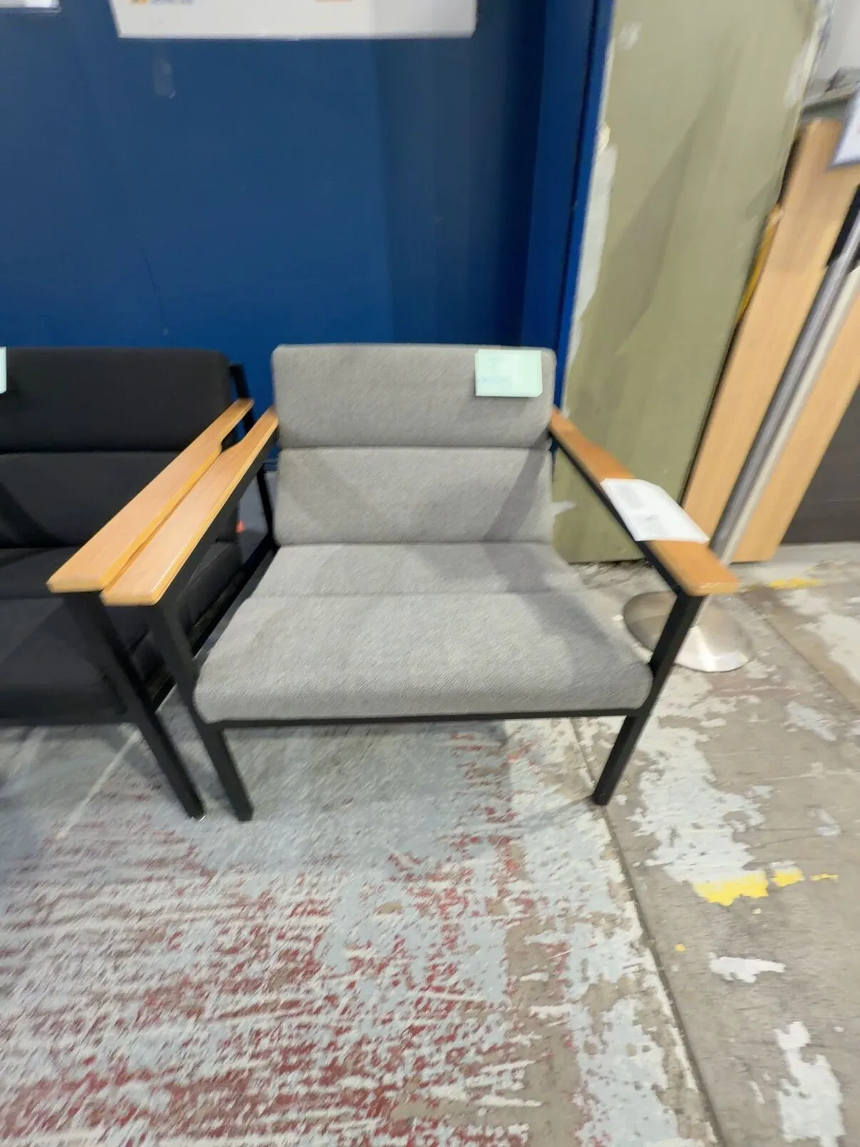 EX STAGING - GREY ARMCHAIR WITH TIMBER ARMS, SOLD AS IS EX STAGING - GREY ARMCHAIR WITH TIMBER ARMS, SOLD AS IS