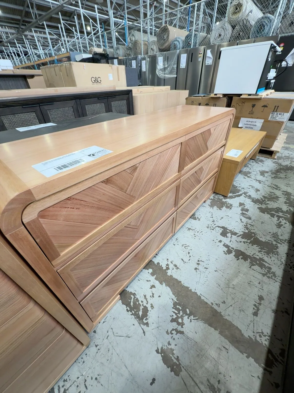 EX DISPLAY EVA DRESSER, CURVED MESSMATE TIMBER WITH HERRINGBONE DRAWERS, SOLD AS IS EX DISPLAY EVA DRESSER, CURVED MESSMATE TIMBER WITH HERRINGBONE DRAWERS, SOLD AS IS