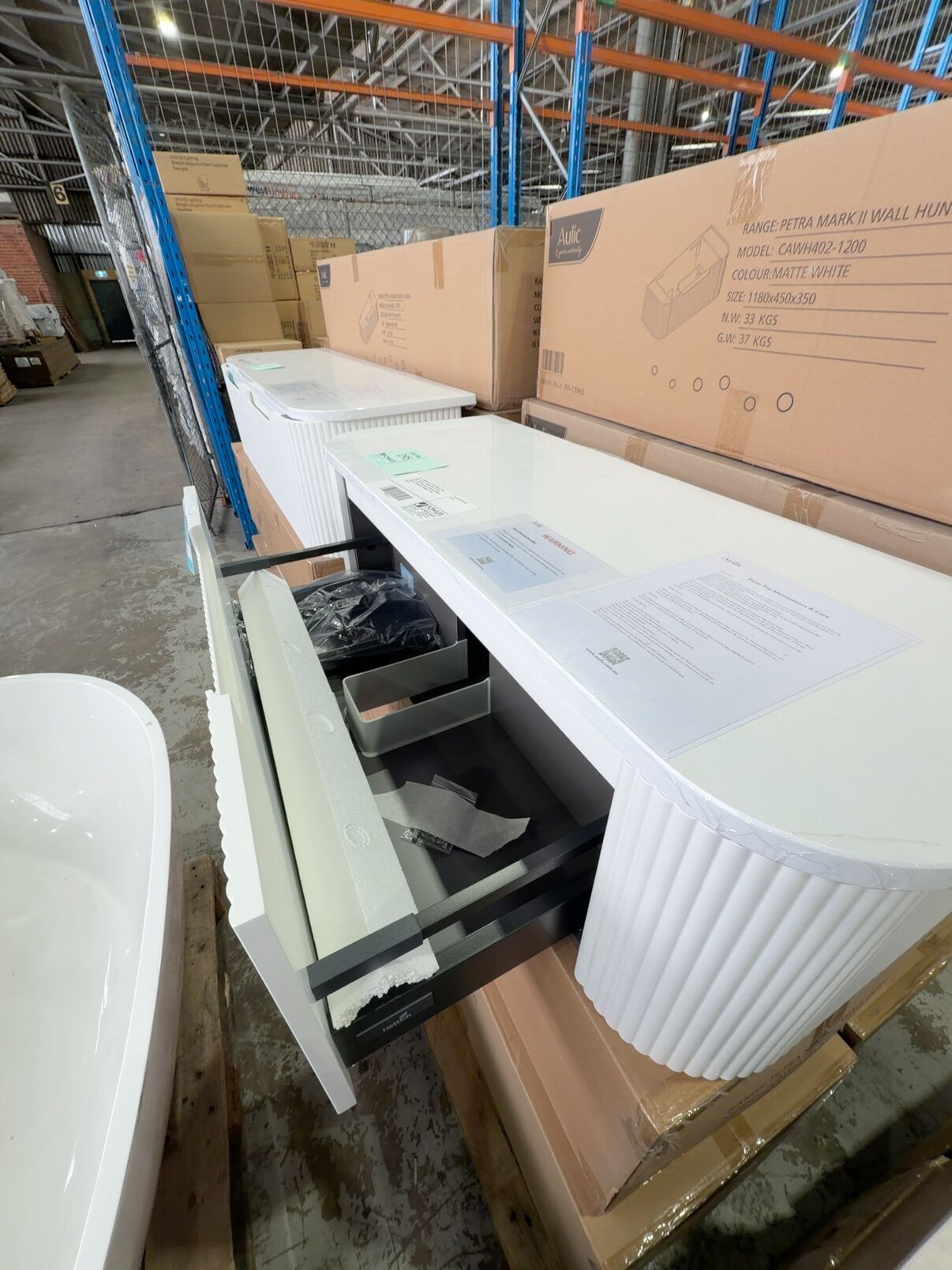 NEW 1200MM AULIC PETRA MARK II WALL HUNG CURVED V GROOVE MATTE WHITE VANITY WITH PURE SOLID SURFACE CURVED STONE TOP RRP$2295 CAWH402-1200-ST56FT NEW 1200MM AULIC PETRA MARK II WALL HUNG CURVED V GROOVE MATTE WHITE VANITY WITH PURE SOLID SURFACE CURVED STONE TOP RRP$2295 CAWH402-1200-ST56FT