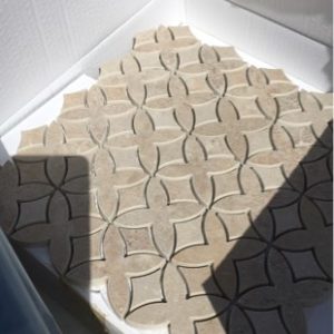PALLET WITH KRONOS CERAMIC TILE BEIGE 600MM X 600MM WITH STONE MOSAIC TILES AS WELL SOLD AS IS