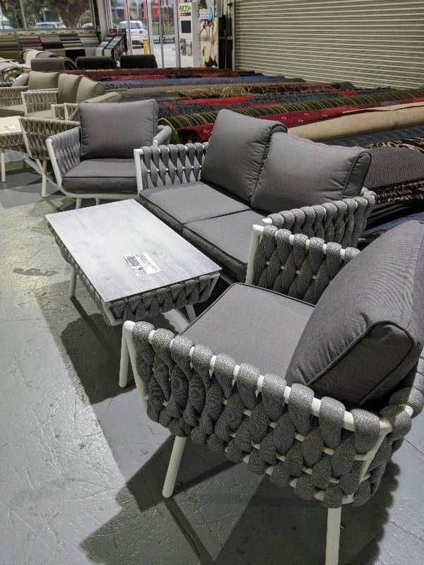 DESIGNER OUTDOOR FURNITURE - 4 PIECE GREY SETTING WITH FIBRE WEAVE 2 SEATER SOFA WITH 2 ARM CHAIRS AND TABLE RRP$1899