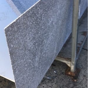 2700MM X 740MM GREY GRANITE STONE BENCH TOP WITH ANGLED EDGE SOLD AS IS