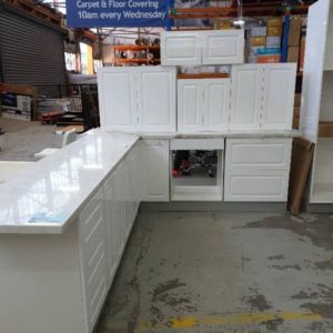 NEW L SHAPE KITCHEN IN HIGH GLOSS WHITE 2 PAC PAINTED FINISH WITH SQUARE ROUTED PROFILE DOORS WITH STAR WHITE RECONSTITUTED STONE BENCH TOPS AL-K10A/SW