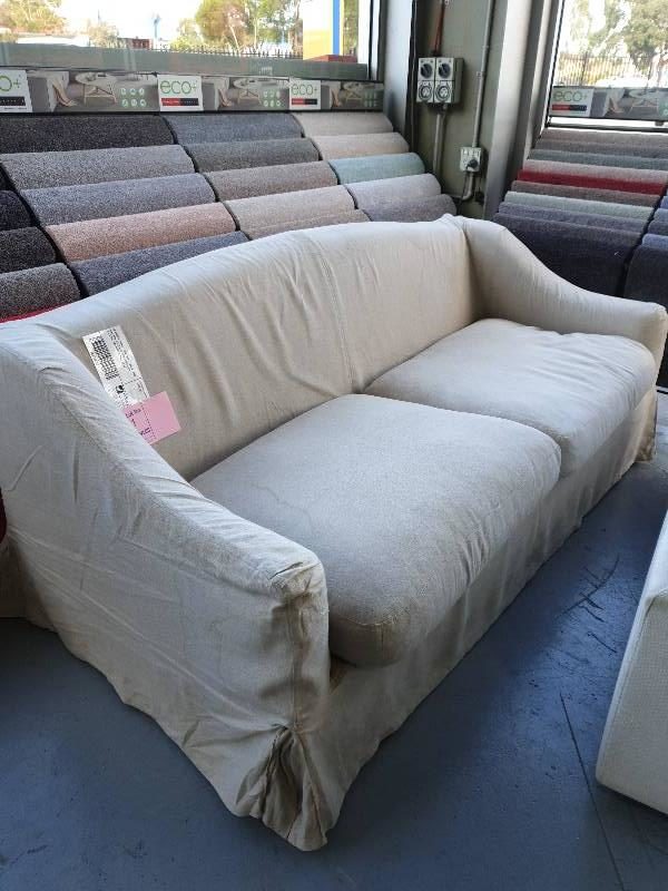EX DISPLAY HOME FURNITURE - BEIGE LINEN MATERIAL 2.5 SEATER COVERED COUCH MATERIAL HAS MARKS SOLD AS IS
