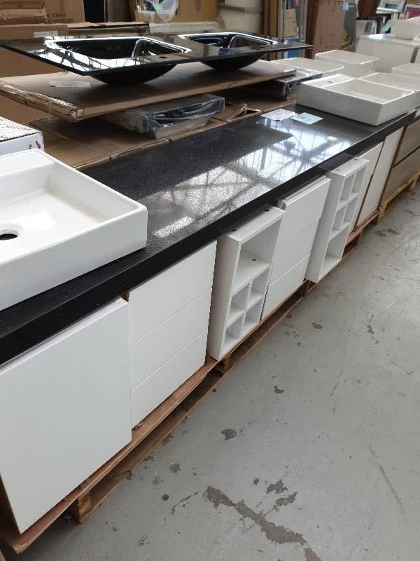 NEW DESIGNER 2550MM DOUBLE BOWL VANITY WITH BLACK STONE TOP VANITY BASE IS IN MODULES THAT YOU JOIN TOGETHER TO DESIGN YOUR OWN VANITY LAYOUT. INCLUDES 3 X DRAWER CABINETS 2 X 345MM DOOR CABINETS & 2 X PIGEON HOLES. RRP$3000