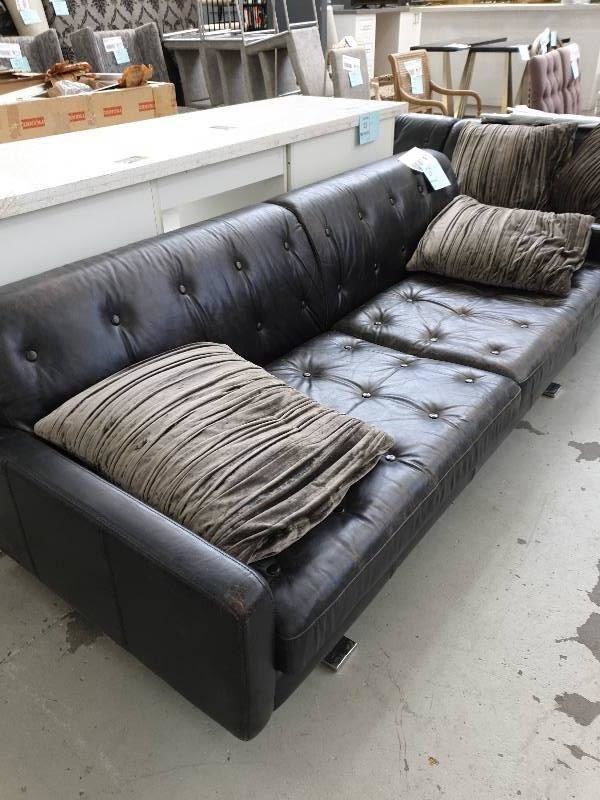 SECOND HAND FURNITURE - BROWN LEATHER 2.5 LARGE COUCH LEATHER IS WORN SOLD AS IS