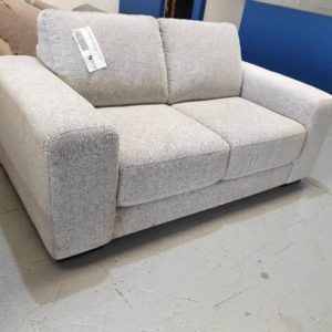 SECOND HAND FURNITURE - GREY MATERIAL UPHOLSTERED 2 SEATER COUCH SOLD AS IS