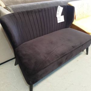 EX HIRE - BLACK UPHOLSTERED 2 SEATER COUCH WITH STUD DETAIL ON BACK SOLD AS IS