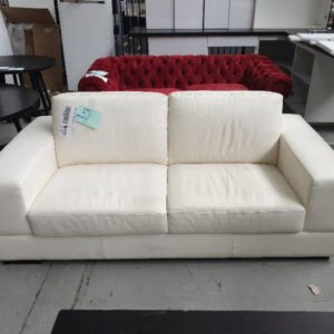 EX DISPLAY HOME FURNITURE - WHITE LEATHER 2 SEATER COUCH SOLD AS IS