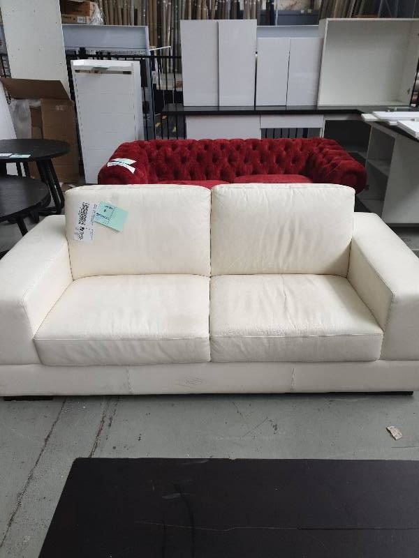 EX DISPLAY HOME FURNITURE - WHITE LEATHER 2 SEATER COUCH SOLD AS IS