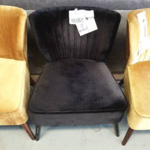 EX HIRE - BLACK UPHOLSTERED ARMCHAIR WITH STUD DETAIL ON BACK SOLD AS IS