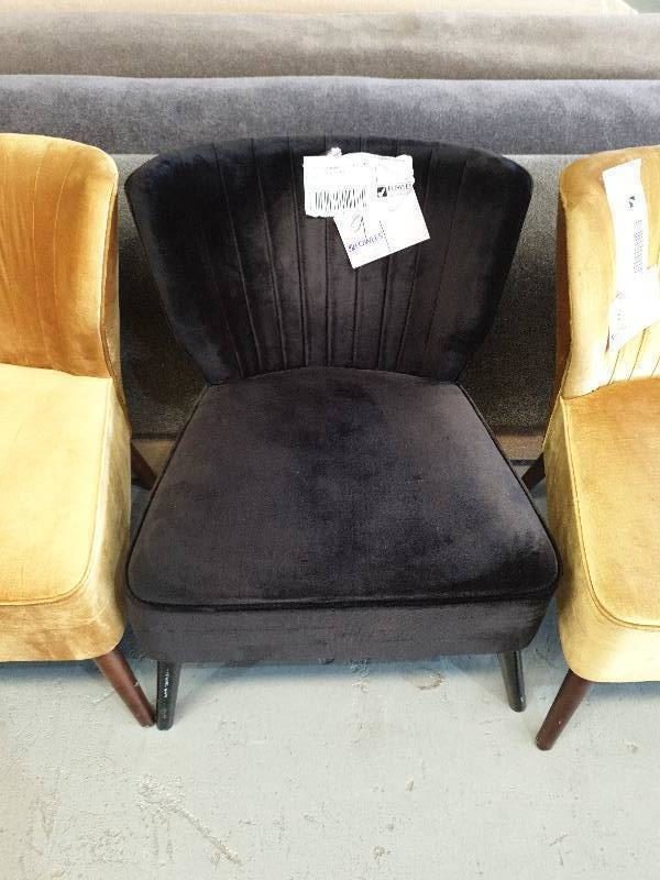 EX HIRE - BLACK UPHOLSTERED ARMCHAIR WITH STUD DETAIL ON BACK SOLD AS IS
