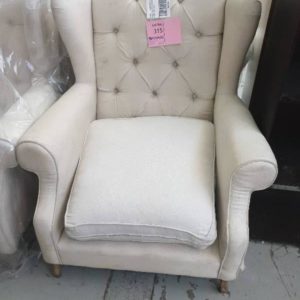 EX HIRE - CREAM UPHOLSTERED WINGBACK CHAIR SOLD AS IS MATERIAL HAS SOME STAINS SOLD AS IS