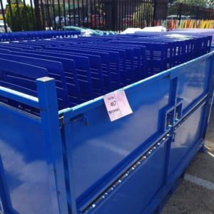 LARGE STILLAGE OF NAVY FOLDING METAL BAR STOOLS **STILLAGE IS NOT INCLUDED IN THE SALE** SOLD AS IS