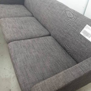 EX FURNITURE HIRE - GREY MATERIAL 2.5 SEATER COUCH WITH TIMBER FRAME SOLD AS IS