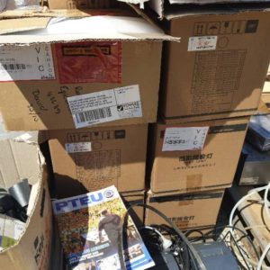 SECOND HAND COMMERCIAL CATERING PALLET OF KITCHEN SCALES CASH REGISTER WITH BOXES OF THERMAL ROLLS ALSO BRONZE LIGHT FITTINGS AND BOX OF BULBS SOLD AS IS