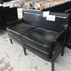 EX HIRE - BLACK 2 SEATER COUCH WITH STUD DETAIL SOLD AS IS