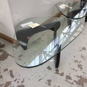 EX HIRE - ABSTRACT SHAPED GLASS TOP COFFEE TABLE WITH BLACK TIMBER LEGS (SOLD AS IS)
