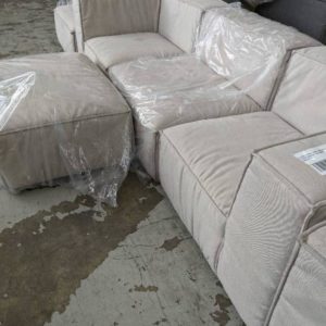 EX HIRE CREAM MATERIAL MODULAR 3 SEATER COUCH WITH OTTOMAN SOLD AS IS