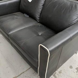 EX DISPLAY 2 SEATER BLACK LEATHER COUCH SOLD AS IS