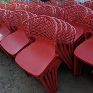 EX HIRE - RED ACRYLIC CHAIR STACKABLE SOLD AS IS
