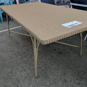 EX HIRE TAN RATTAN OUTDOOR DINING TABLE SOLD AS IS