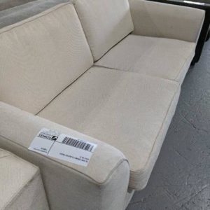 EX HIRE CREAM 2.5 SEATER COUCH SOLD AS IS