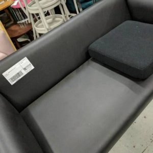 EX HIRE - LARGE BLACK PU COUCH SOLD AS IS