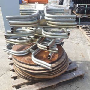 EX-HIRE PALLET OF ROUND TABLE TOPS AND METAL LEGS SOLD AS IS