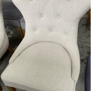 EX HIRE FURNITURE - BEIGE BUTTON UPHOLSTERED DINING CHAIR WITH METAL HANDLE ON THE BACK SOLD AS IS