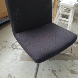 EX HIRE FURNITURE - BLACK LOW ARMCHAIR CHROME LEGS SOLD AS IS