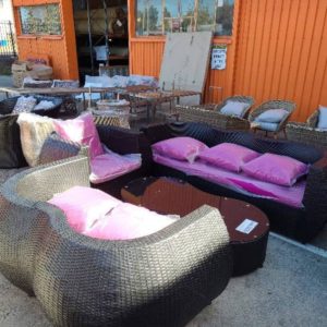 BLACK RATTAN OUTDOOR SETTING WITH COUCH ARM CHAIR AND KIDNEY SHAPED COFFEE TABLE WITH GLASS TOP