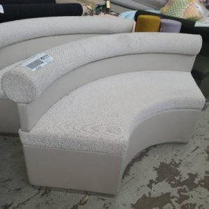 EX HIRE - TEXTURED BEIGE CURVED COUCH SOLD AS IS