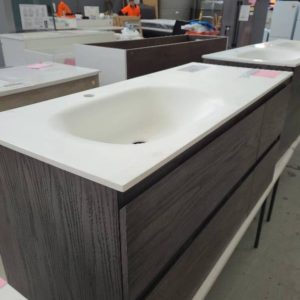 SAMPLE 1200MM DARK COLOURED VANITY WITH 2 LARGER LEFT SIDE DRAWERS AND 2 SMALL RIGHT SIDE DRAWERS AND MOULDED VANITY TOP RRP$2000 PALLET 7