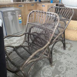 EX HIRE - PAIR OF CANE OUTDOOR ARM CHAIR SOLD AS IS