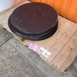 PALLET OF BLACK ROUND TABLE TOPS SOLD AS IS