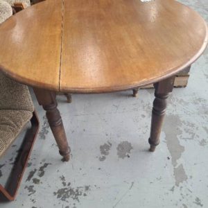 SECOND HAND ANTIQUE STYLE FURNITURE - ROUND TIMBER DINING TABLE SOLD AS IS