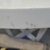 EX HIRE ROUND WHITE TIMBER DINING TABLE 1300MM CHIPPED & DAMAGED CHECK PICTURES SOLD AS IS NO BOLTS SUPPLIED TO CONNECT TABLE TO BASE