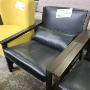EX-HIRE BLACK LEATHER LOW ARMCHAIR SOLD AS IS