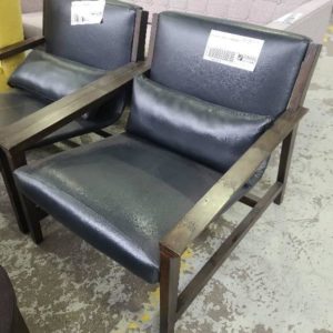 EX-HIRE BLACK LEATHER LOW ARMCHAIR SOLD AS IS