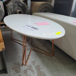 EX-HIRE WHITE OVAL COFFEE TABLE WITH BRONZE LEGS SOLD AS IS