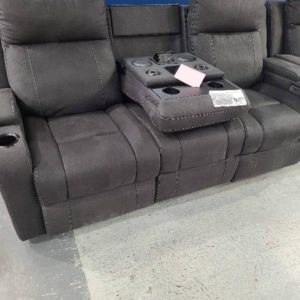 EX DISPLAY PARAMOUNT CHARCOAL FABRIC 3 SEATER COUCH WITH ELECTRIC RECLINERS PULL DOWN CENTRAL HEAD WITH WIRELESS CHARGING CUP HOLDERS LIGHTS SPEAKERS UNDERNEATH SUB WOOFER POWERED RECLINERS AND HEADRESTS RRP$2999 SOLD AS IS