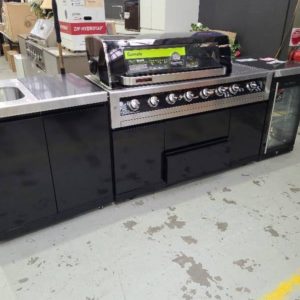 EX DISPLAY GASMATE OUTDOOR BBQ KITCHEN WITH GASMATE GALAXY 6 BURNER BBQ WITH HOOD WITH GASMATE PREMIUM SINGLE DOOR FRIDGE ON RIGHT WITH SINK MODULE ON LEFT INCLUDING TAP AND BIN BLACK GALAXY STONE BENCH TOPS RRP$7999