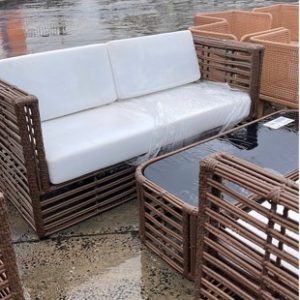 EX HIRE RATTAN OUTDOOR SETTING 2 X ARM CHAIRS 1 X COUCH AND COFFEE TABLE SOLD AS IS