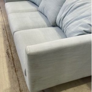 EX HIRE AQUA MATERIAL COUCH SOLD AS IS