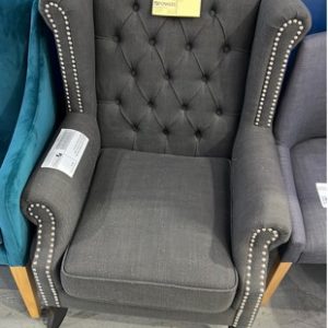 EX DISPLAY GREY MATERIAL WING BACK ARM CHAIR WITH STUD DETAIL SOME PILLING ON MATERIAL SOLD AS IS