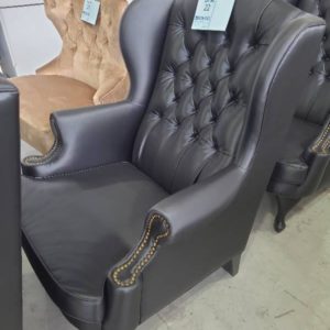 EX HIRE BLACK PU BUTTON UPHOLSTERED WING BACK CHAIR SOLD AS IS