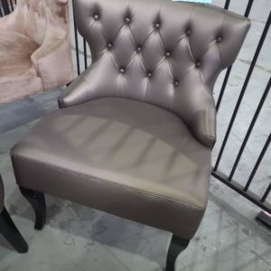 EX HIRE BRONZE BUTTON UPHOLSTERED LOW CHAIR SOLD AS IS