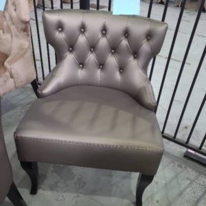 EX HIRE BRONZE BUTTON UPHOLSTERED LOW CHAIR SOLD AS IS